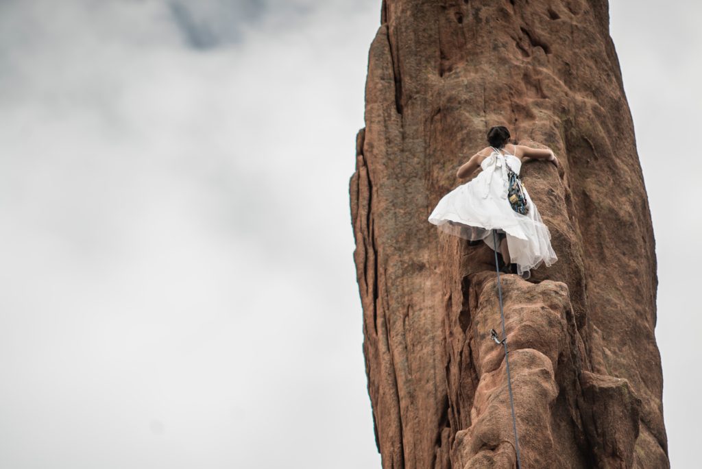 woman climbing in a white dress