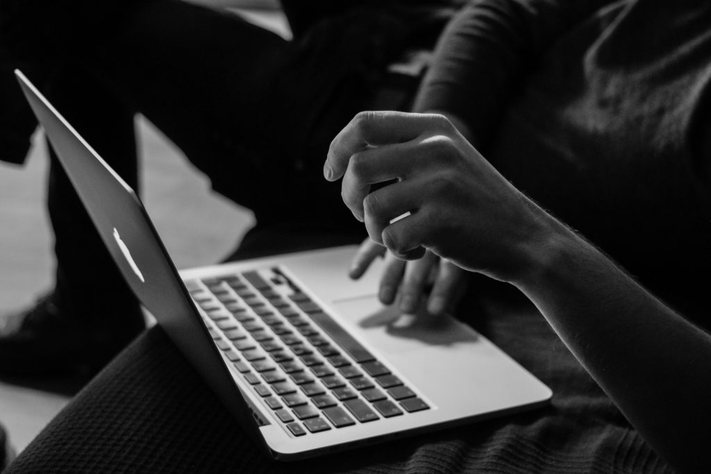 woman typing, black and white