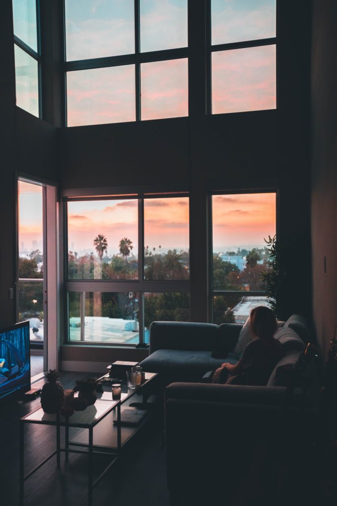 woman sitting on couch alone